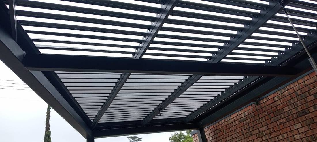 Charcoal adjustable louvre canopy over the terrace at McDonald's Grahamstown