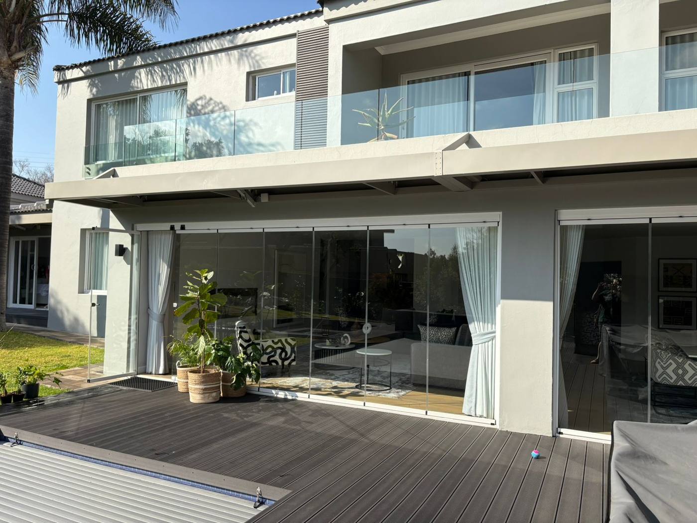 Motorised louvre cantilevered off the house over a composite deck at Dainfern Estate